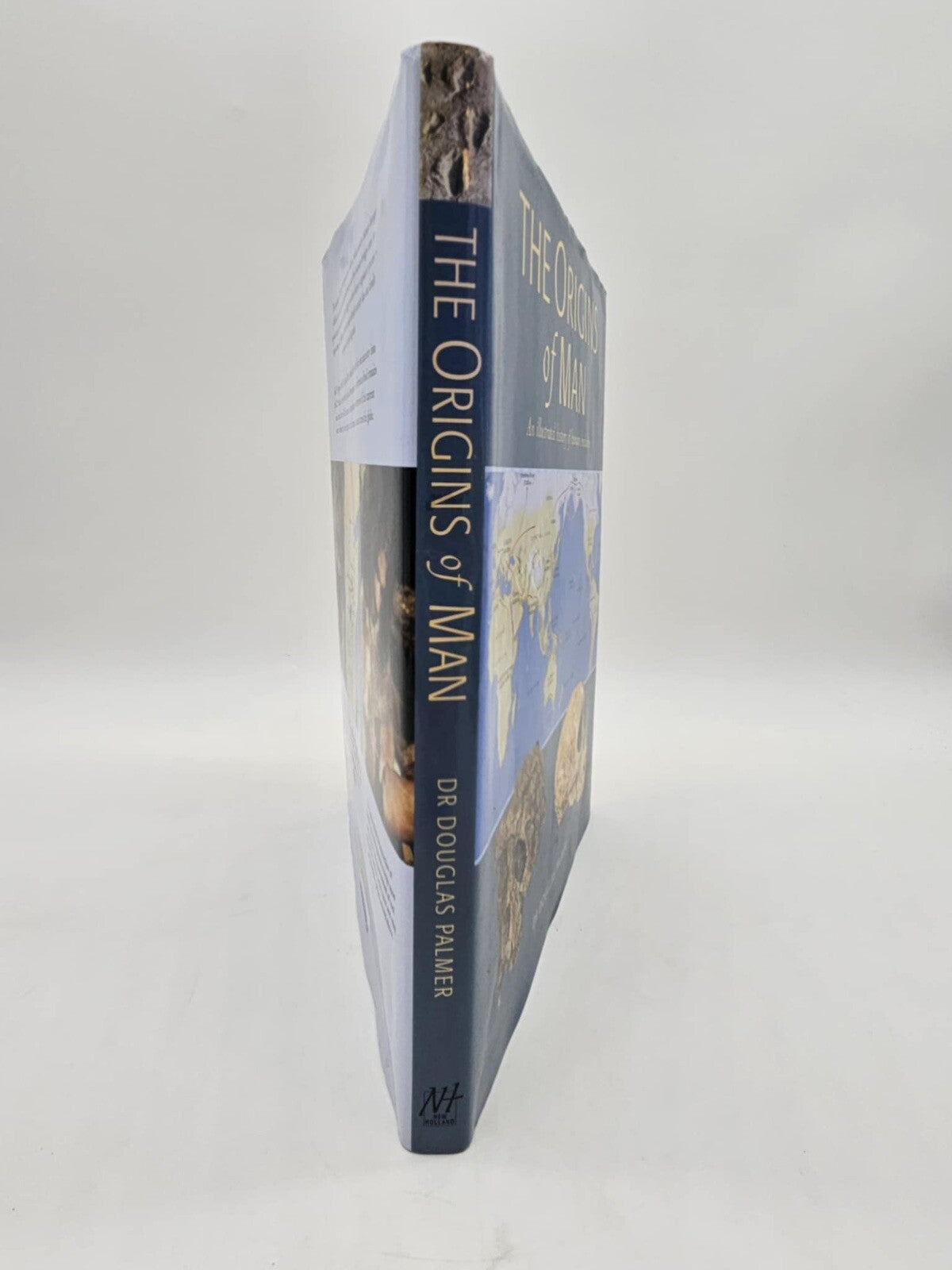 The Origins of Man: An Illustrated History of Human Evolution - Hardcover - GOOD