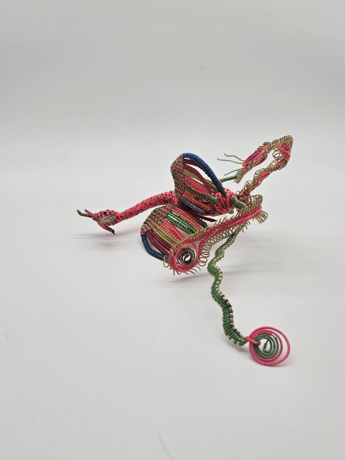 vintage, handcrafted peacock or phoenix figurine