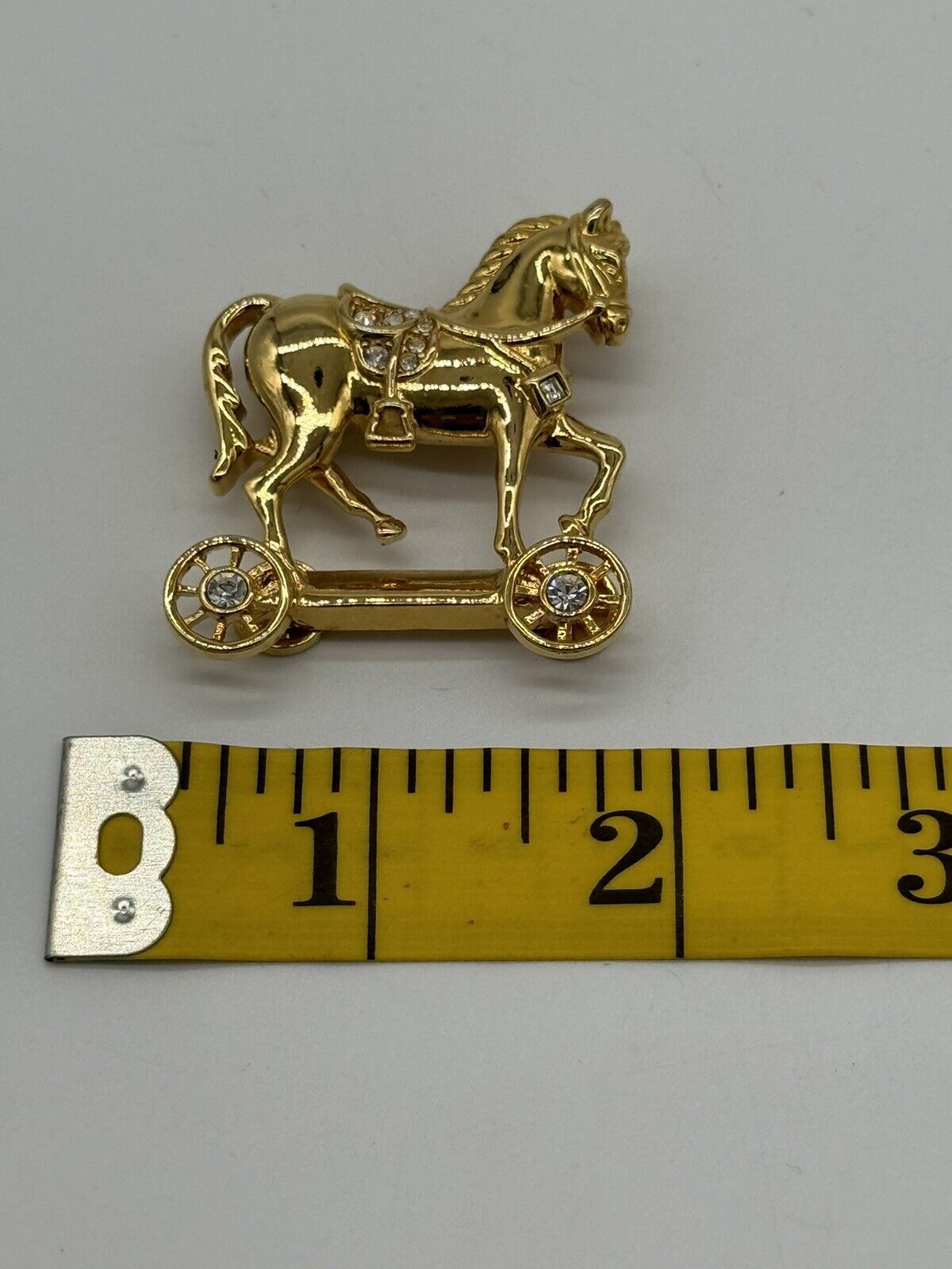 Avon Smithsonian Horse On Wheels Brooch With  Rhinestones Gold Rhodium Plated