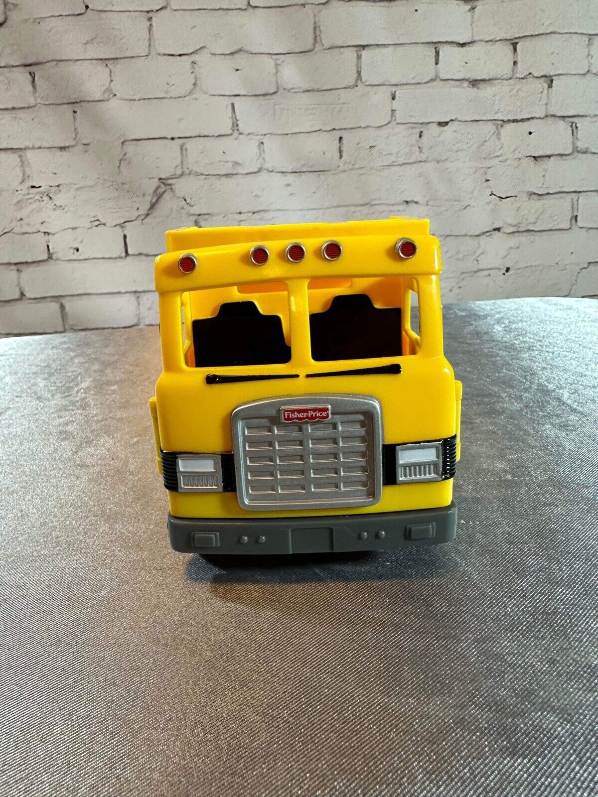 FISHER PRICE DUMP TRUCK PLASTIC 7"X 4" LEVER ACTION POPS UP BACK VTY