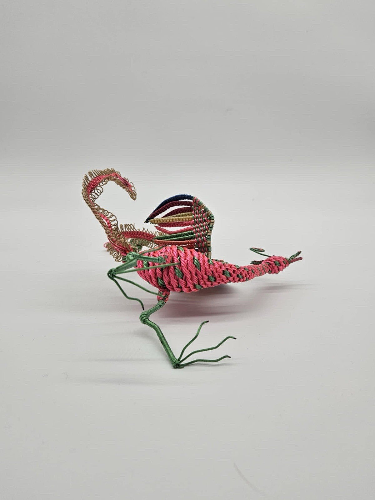 vintage, handcrafted peacock or phoenix figurine