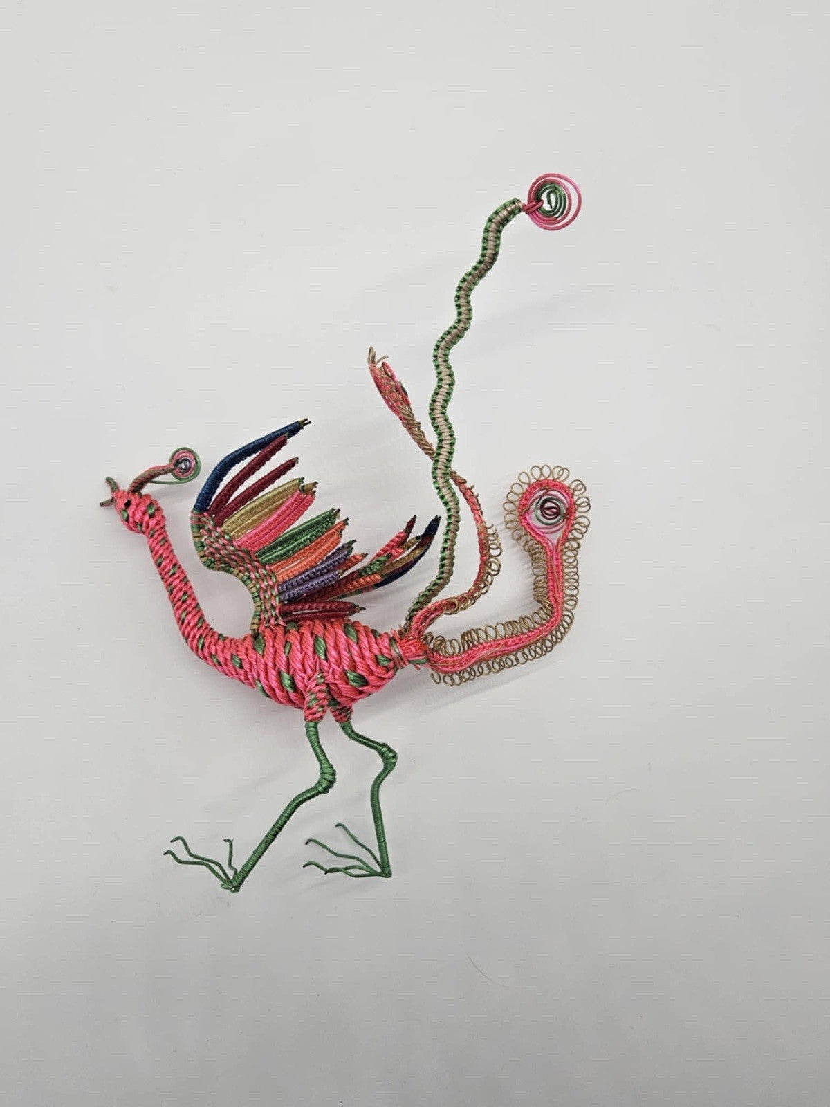 vintage, handcrafted peacock or phoenix figurine