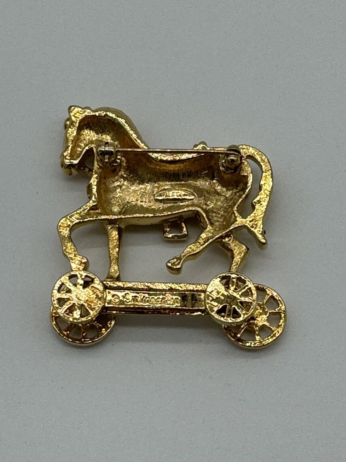 Avon Smithsonian Horse On Wheels Brooch With  Rhinestones Gold Rhodium Plated