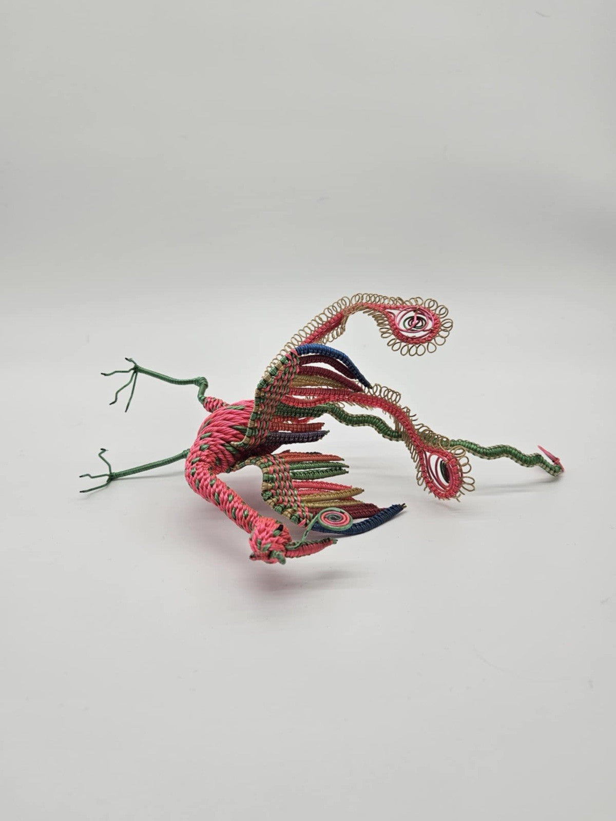 vintage, handcrafted peacock or phoenix figurine