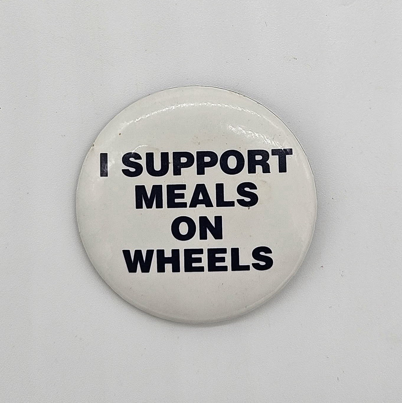 Vintage “I Support Meals on Wheels” Pinback Button