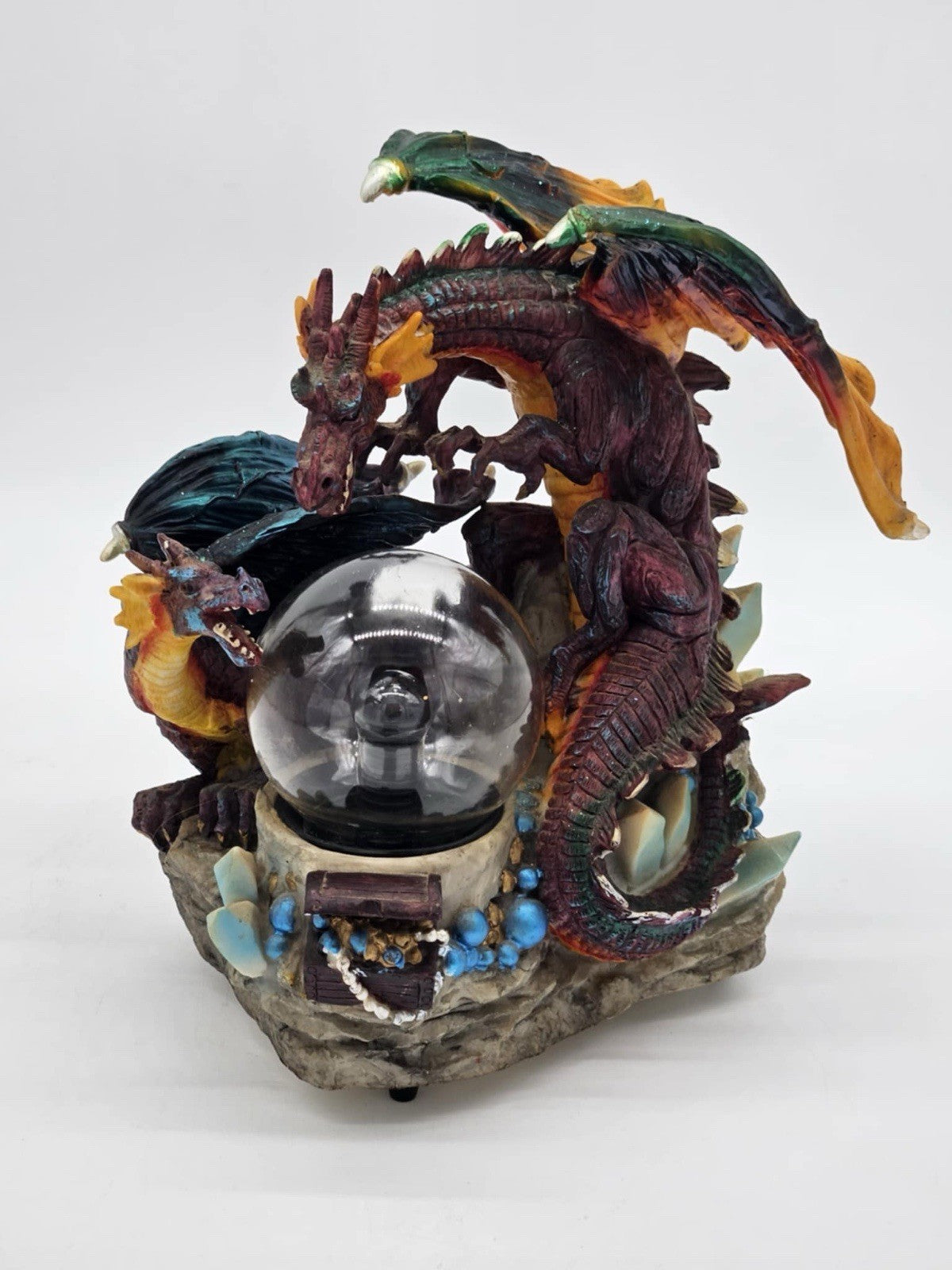 Green and Purple/Red Dragons Fighting over Lighted Orb of Power