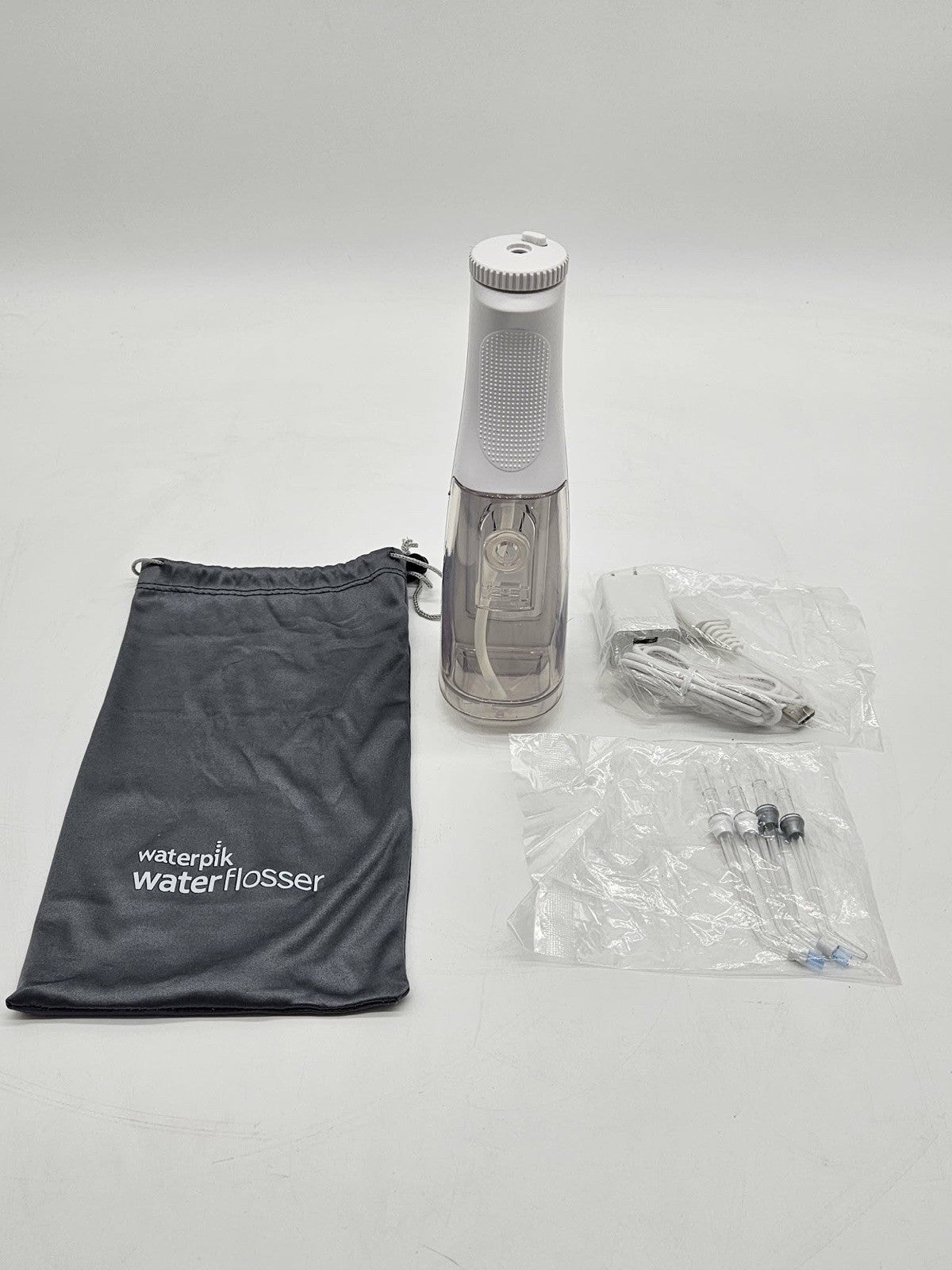 Waterpik Cordless Water Flosser White w Tips Charger Travel Bag Preowned