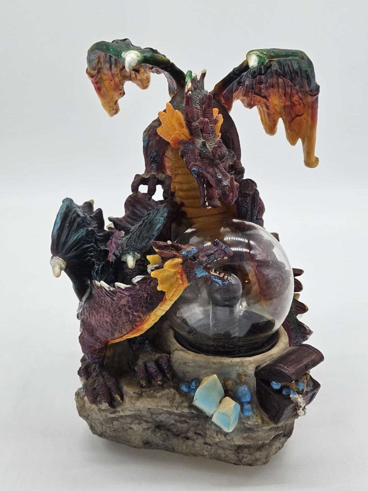 Green and Purple/Red Dragons Fighting over Lighted Orb of Power