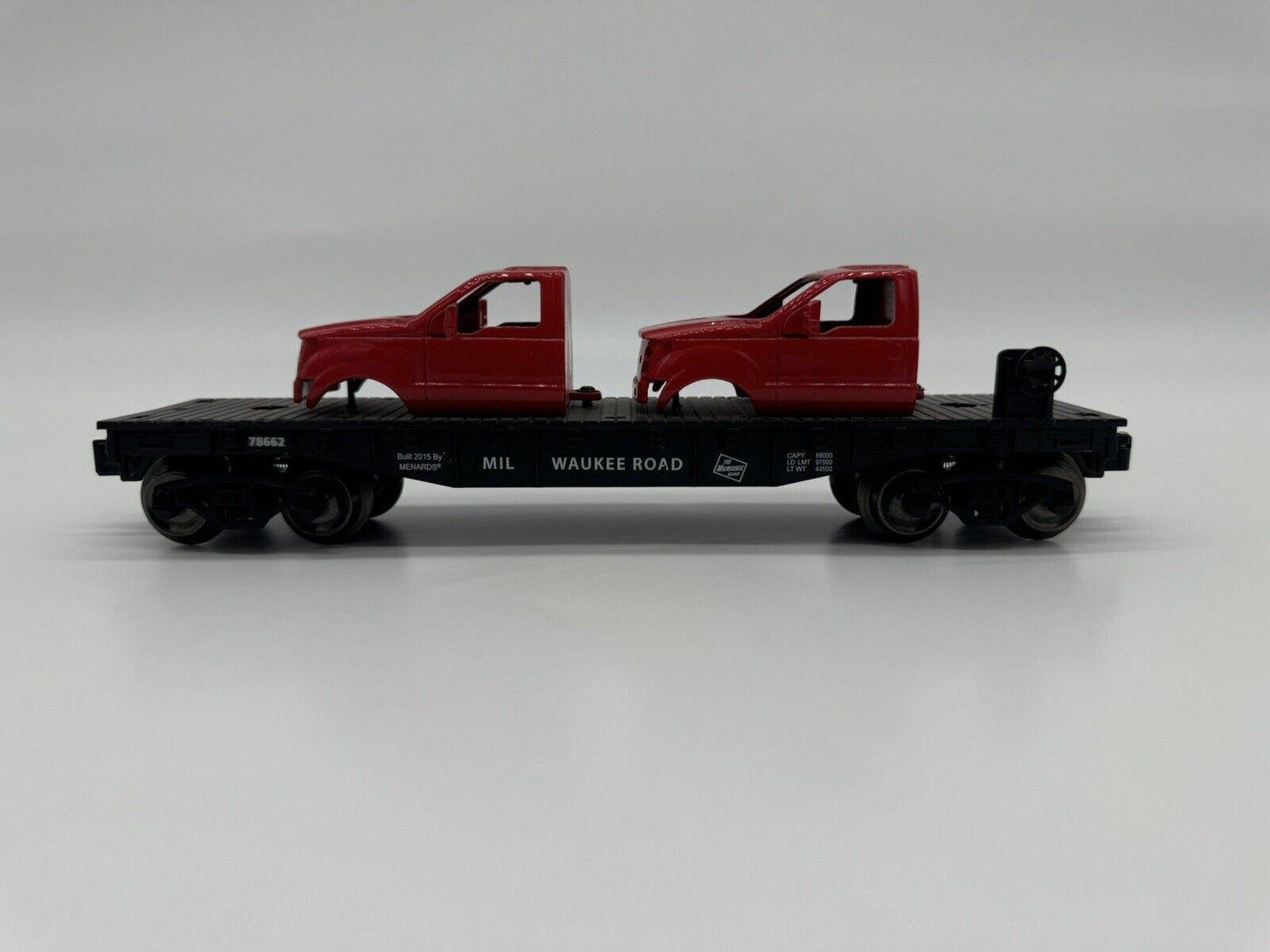 MENARD’S  GOLD LINE MILWAUKEE ROAD FLATCAR WITH TWO F150 CAB LOAD 279-266