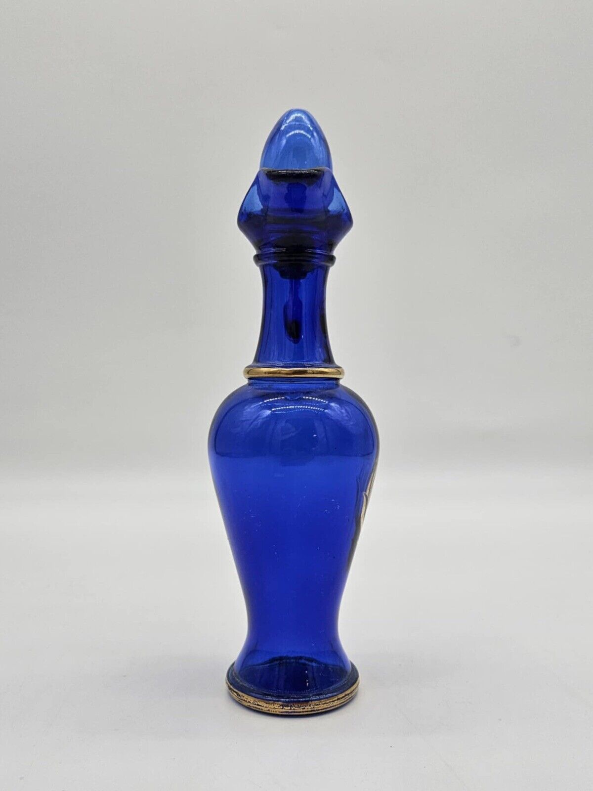 Vintage Avon Bottle With Plugs & Gold Ornament Made of Glass Cobalt Blue # 10