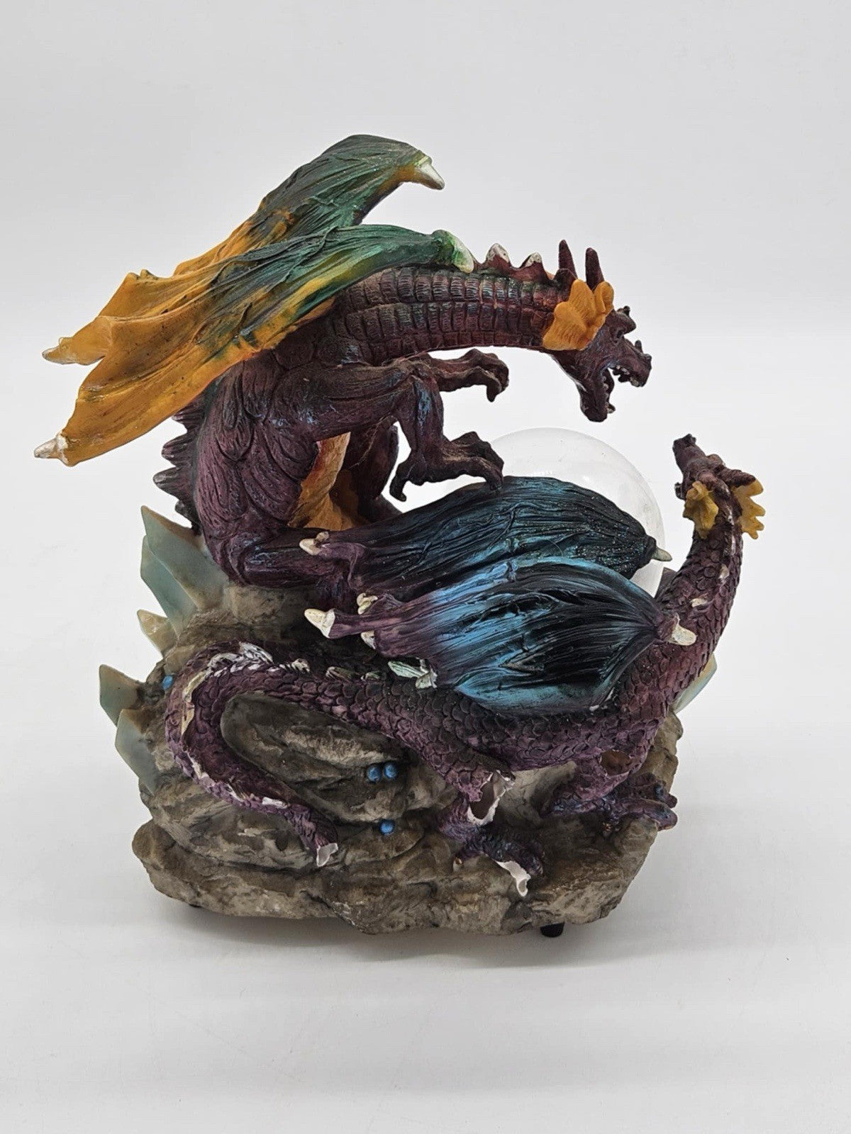 Green and Purple/Red Dragons Fighting over Lighted Orb of Power