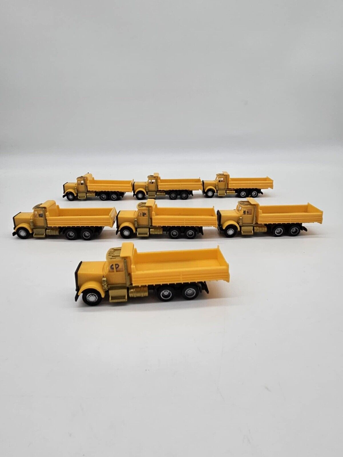 Lot of 7 Plastic Yellow Toy Dump Trucks Party Favor Cake Topper