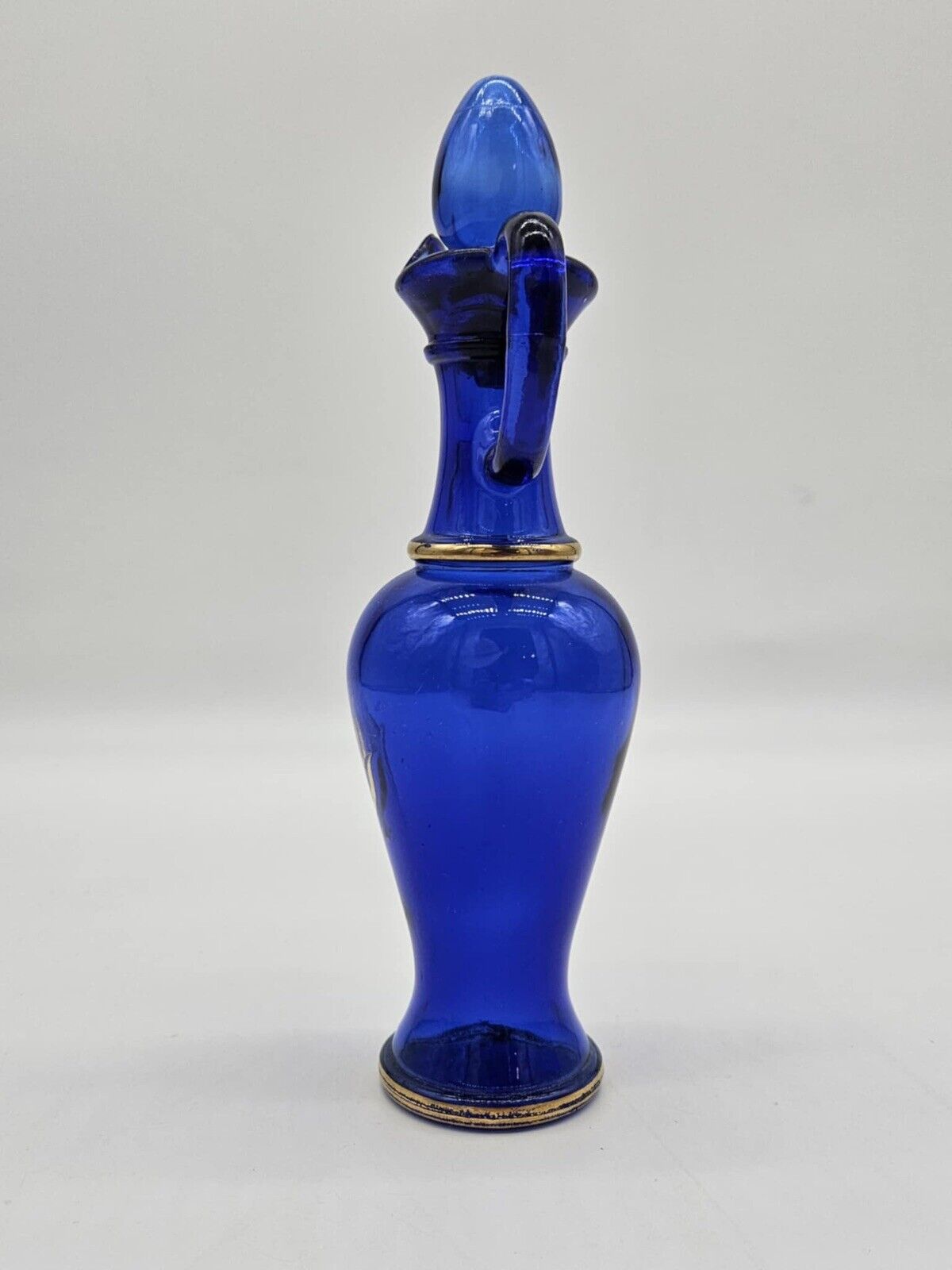 Vintage Avon Bottle With Plugs & Gold Ornament Made of Glass Cobalt Blue # 10