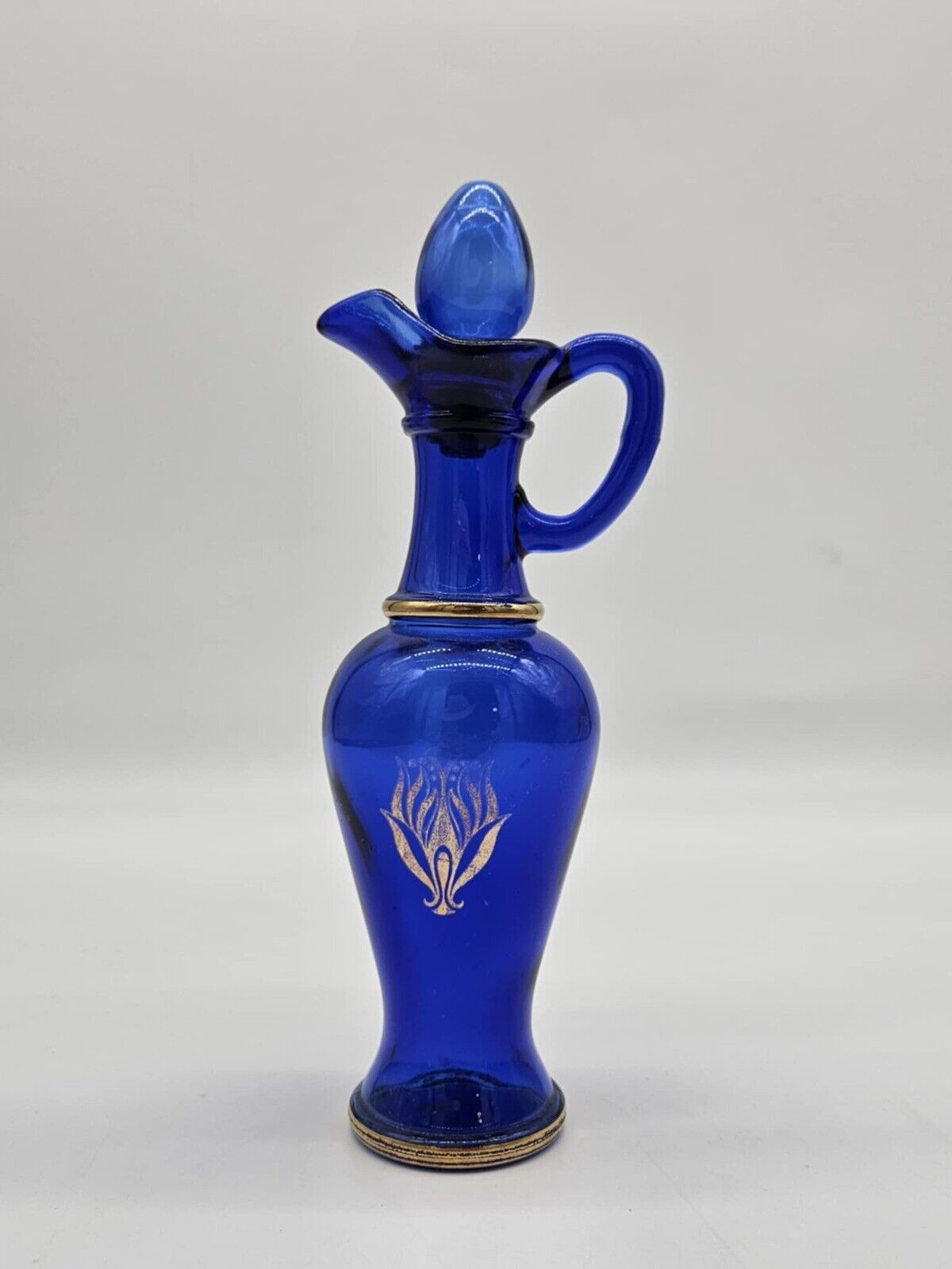 Vintage Avon Bottle With Plugs & Gold Ornament Made of Glass Cobalt Blue # 10
