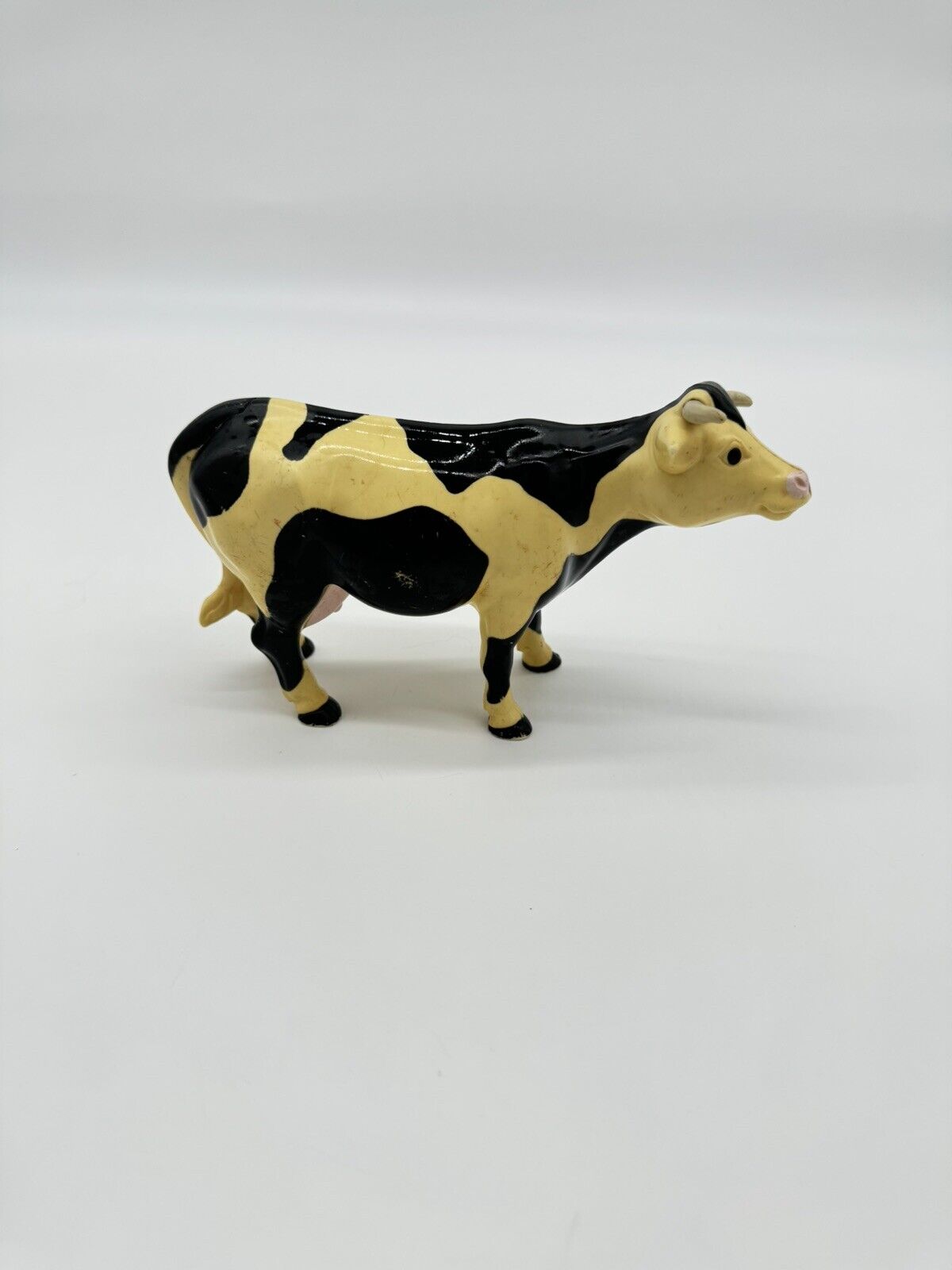 Vintage Plastic Cow Figure Toy Black And White Farm 1996 4"1/4 tall. 7"1/4 long.