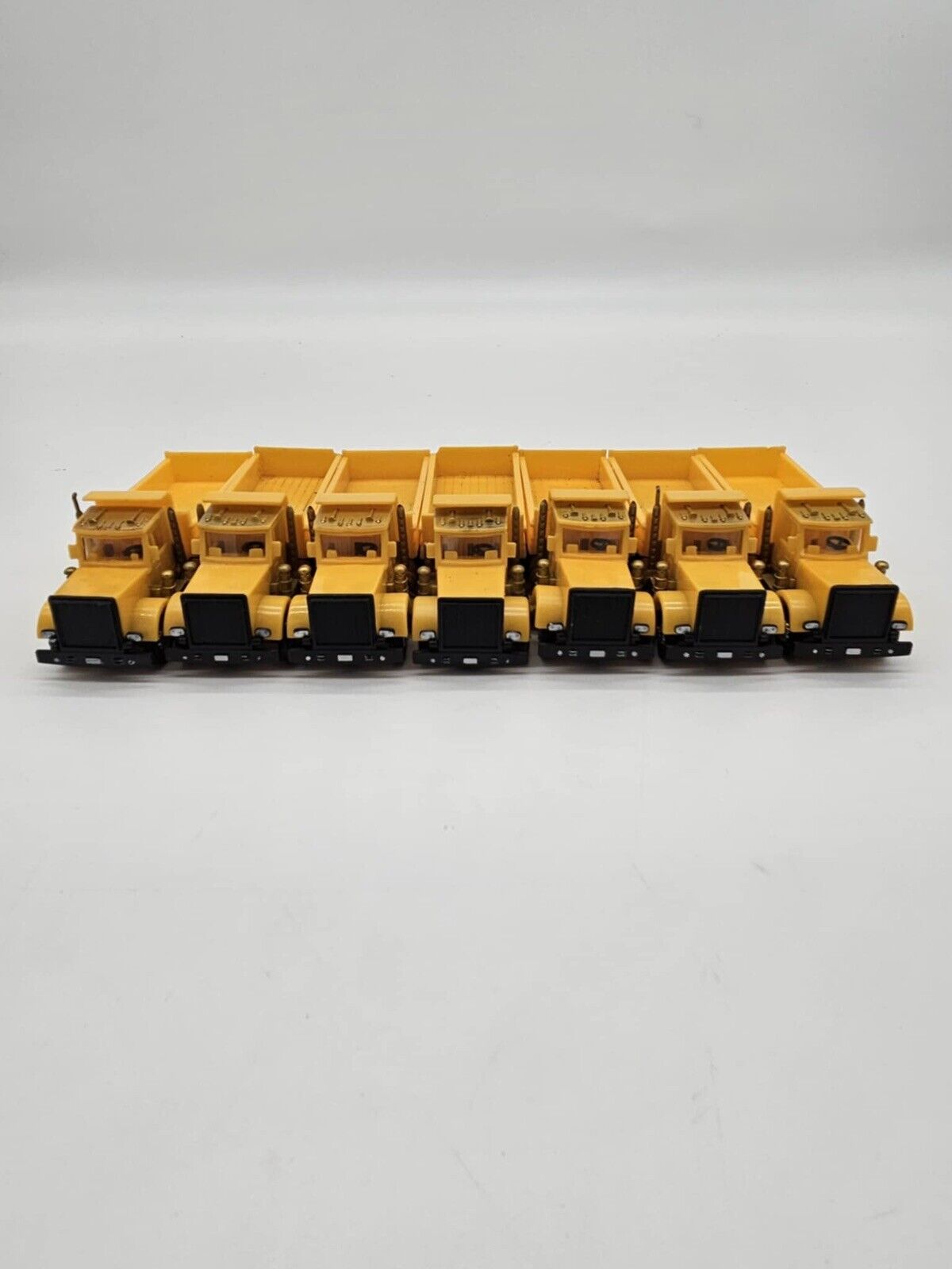 Lot of 7 Plastic Yellow Toy Dump Trucks Party Favor Cake Topper
