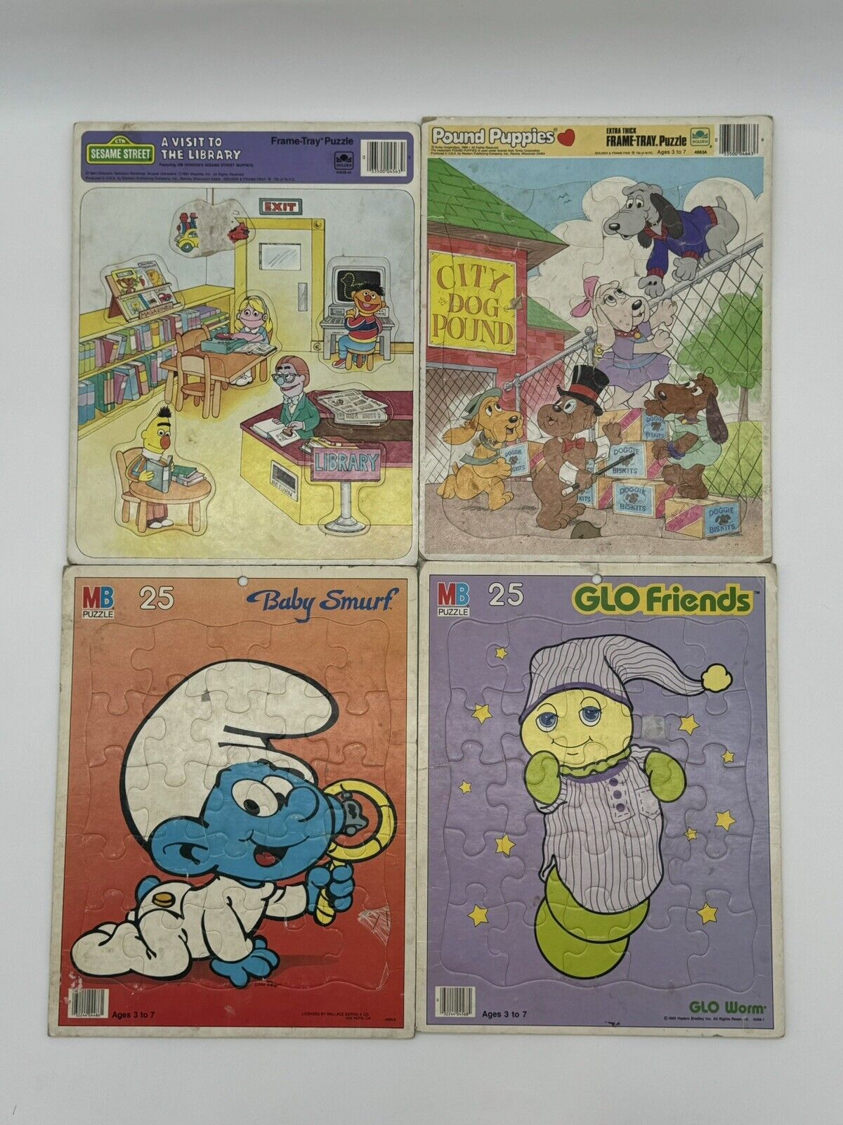 Set Of Four Vintage 80's Frame Tray Puzzles Smurfs Glo Friends Pound Puppies SS