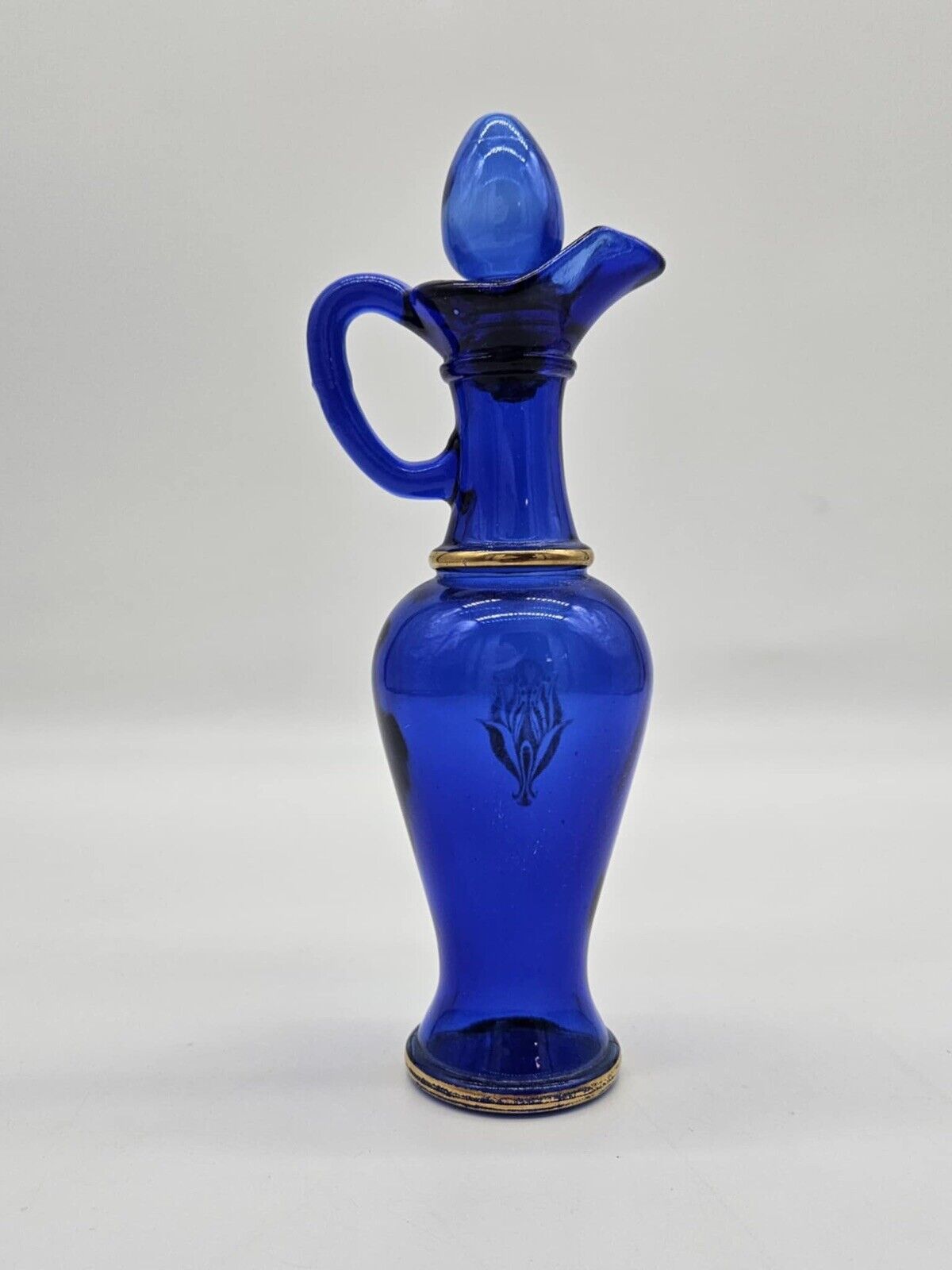 Vintage Avon Bottle With Plugs & Gold Ornament Made of Glass Cobalt Blue # 10